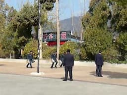 Hotel staff in Li Jiang, China carrying out exercises and fire drills