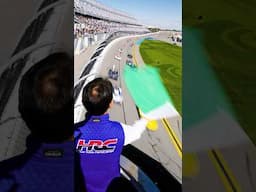 Honda Racing Corporation Global President Koji Watanabe waves the green flag at the Rolex 24.