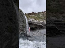 Beach camp with a waterfall, Devon.