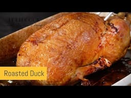 Roast duck with red cabbage and potato pancakes