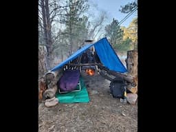 Tarp Shelter with  a Culvert Fire Place