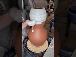 Adding porcelain slip to a wheel-thrown stoneware vase. Enjoy!