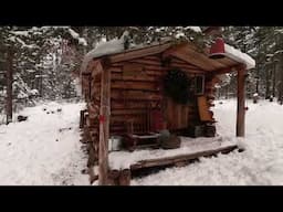 Snow Covered Log Cabin