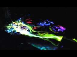 Art In The Dark. Radioactive. Glow Stick Painting, Planets in outer Space