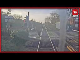 Video shows terrifying moment 'oblivious' woman is nearly mown down by train