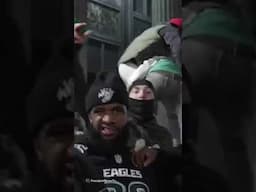 Philadelphia Eagles fans climb over cars