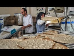 Baking thin, crispy and very tasty local bread with wholemeal flour in Isfahan