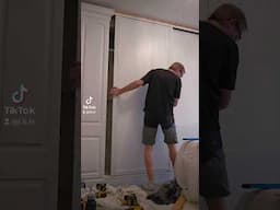 Adding some sliding doors to a built-in wardrobe space.