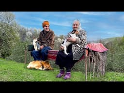 Happy old age of an elderly couple in a mountain village far from civilization