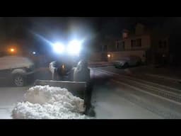 clearing snow with skid steer