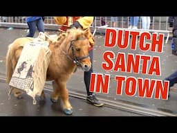 Dutch Santa arrives in Amsterdam with Rain, Rainbow and Gifts