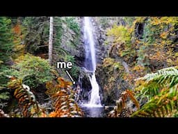 Wild swimming in a roaring waterfall in the Scottish Highlands