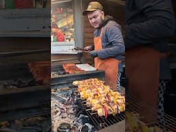 Prague Christmas Market. Grill of Sausages and Skewers. Street Food