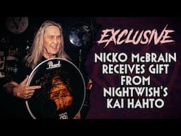 Nicko McBrain receives signed Nightwish Human :II: Nature drum head at Rock N Roll Ribs