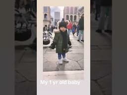 one year old baby playing with doves