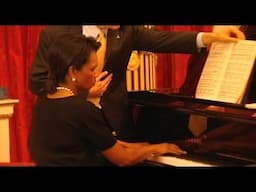 Condoleezza Rice playing the piano for Queen Elizabeth II