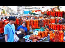 Crowds Scramble for Roast Pork: A Taste of Cambodian Chinese New Year