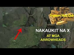 NAKAUKIT NA X AT MGA ARROWHEADS NA MARKA SA MALAKING BATO