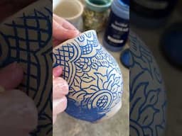 Wiping back underglaze to to reveal the handcarved design! #potterymagic #handcarved