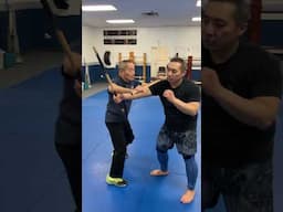 Training close range single stick locking and takedowns