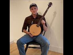 Wayne Branch and his banjo in the Student Work exhibition at Center for Furniture Craftsmanship.