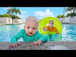 Maggie and baby brother swim in the POOL